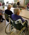 [Translate to English:] To ældre i kørestol på plejehjem.