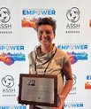 Photo shows Janni Kjærgaard Thillemann with the award in her hands